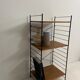 small vintage metal and teak string bookshelf