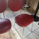 Pair of burgundy faux leather chairs