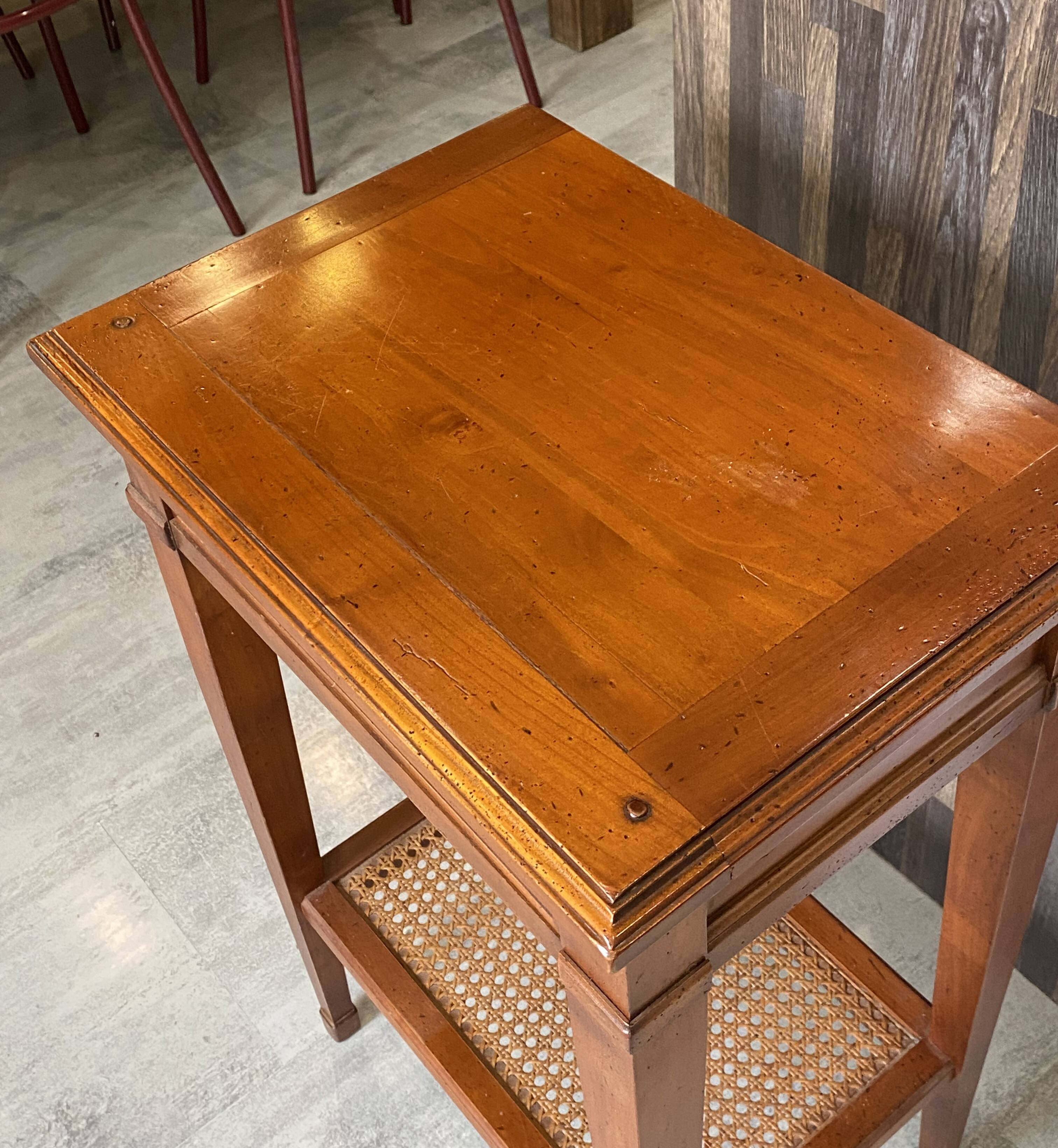 Occasional table in cherry wood, 1 drawer, 1 cane shelf, 1950.
