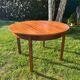 Extendable round table by Luigi Bartolini