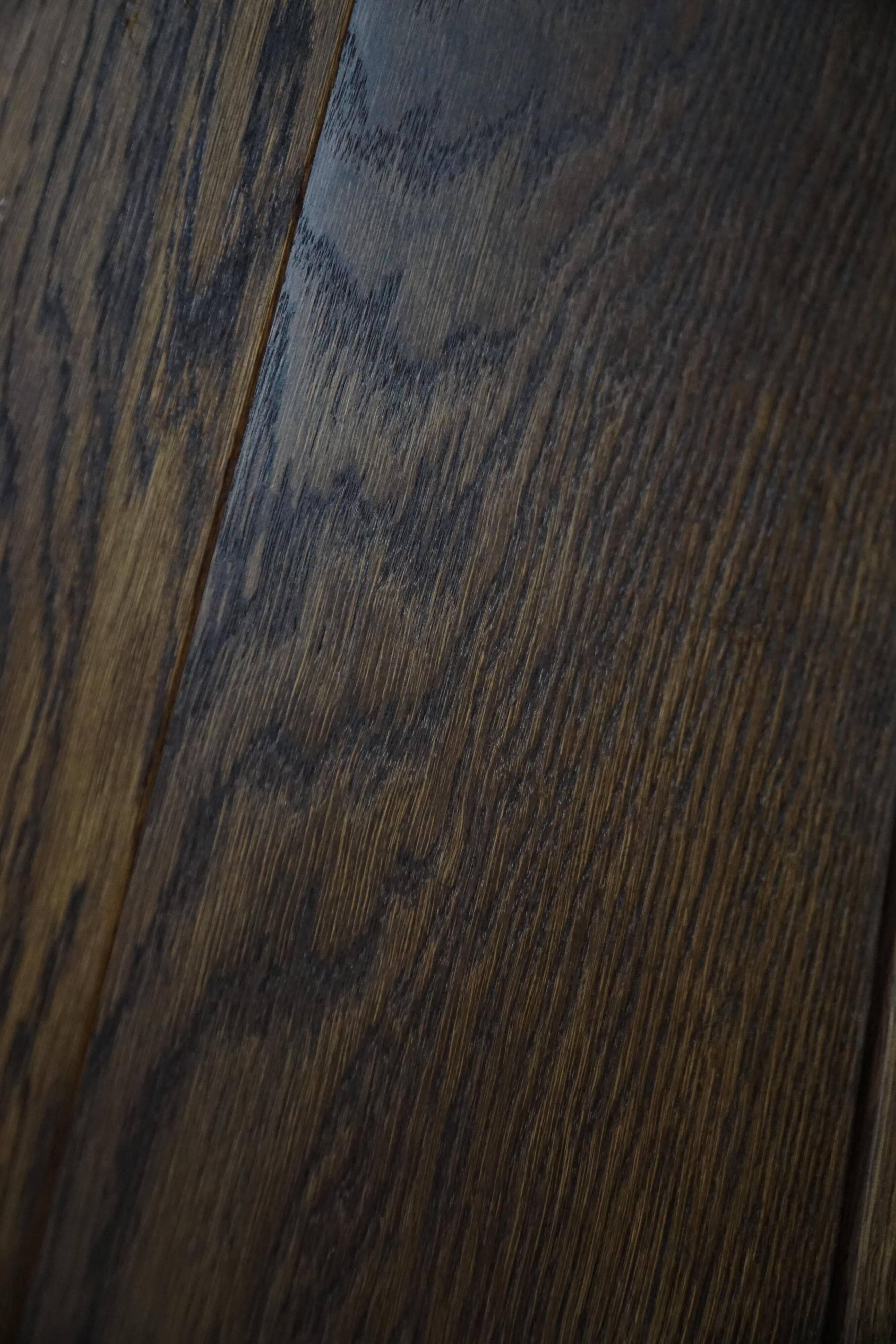 Modern Danish oak commode with decorative relief sculpture, mid-20th century.