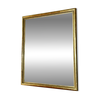 Antique gilded mirror with pearl and gold leaf.