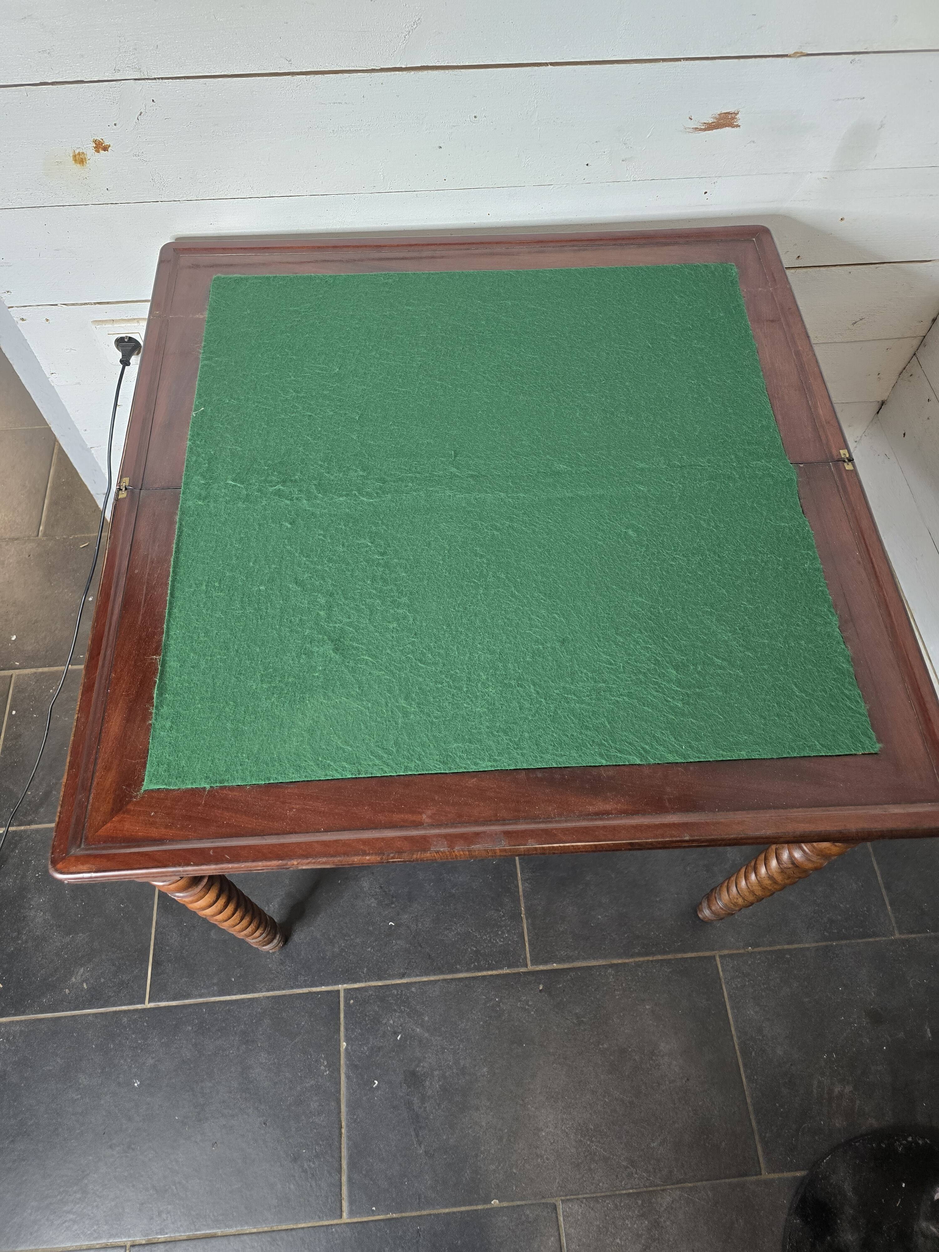 Old mahogany game table