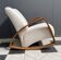 Fauteuil à bascule en tissu bouclé blanc