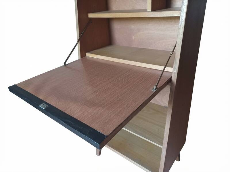 Vintage 1960s secretary desk with an angled design, light wood, and tapered legs.