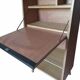 Vintage 1960s secretary desk with an angled design, light wood, and tapered legs.
