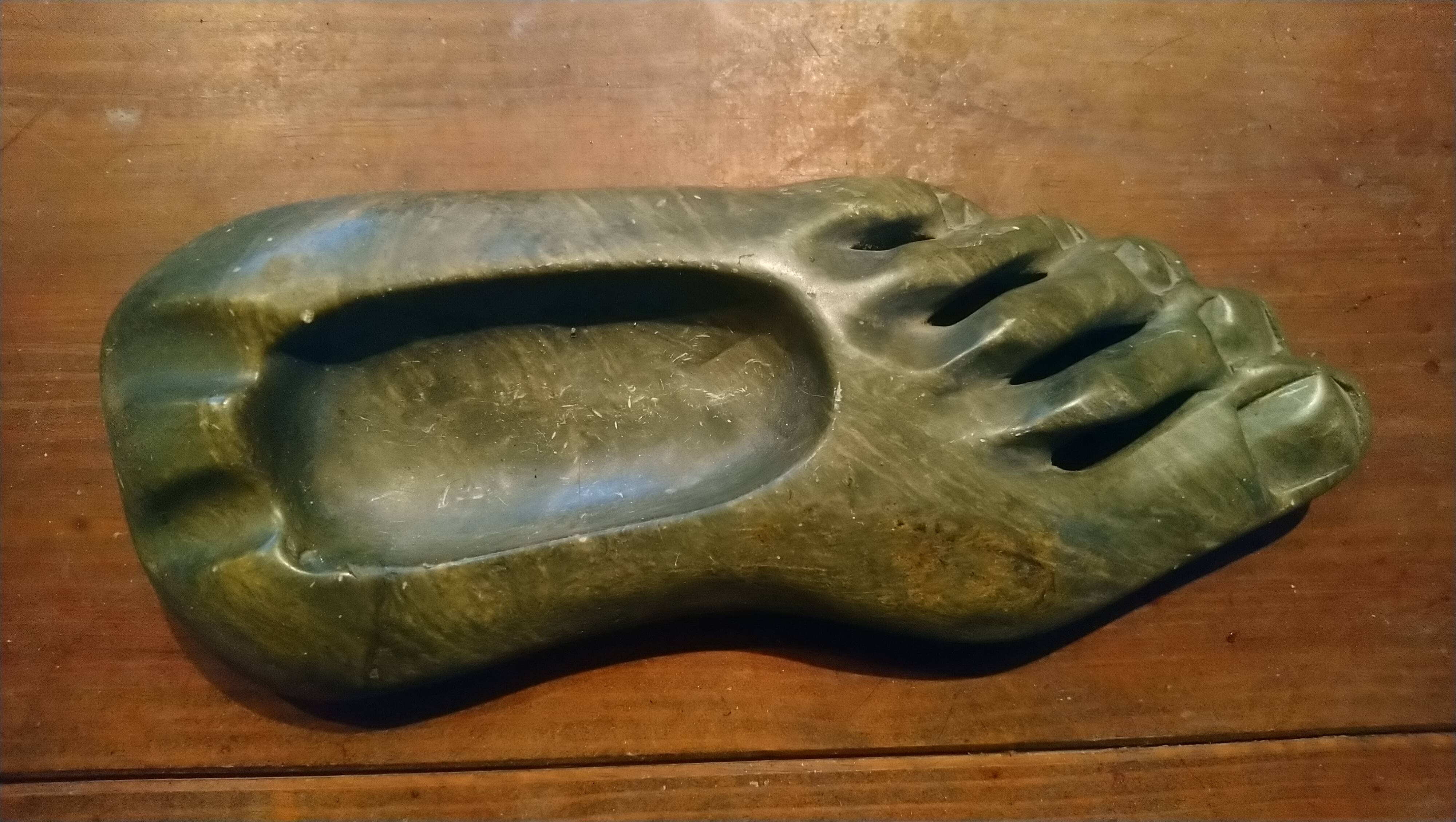 Ashtray in carved and polished stone.