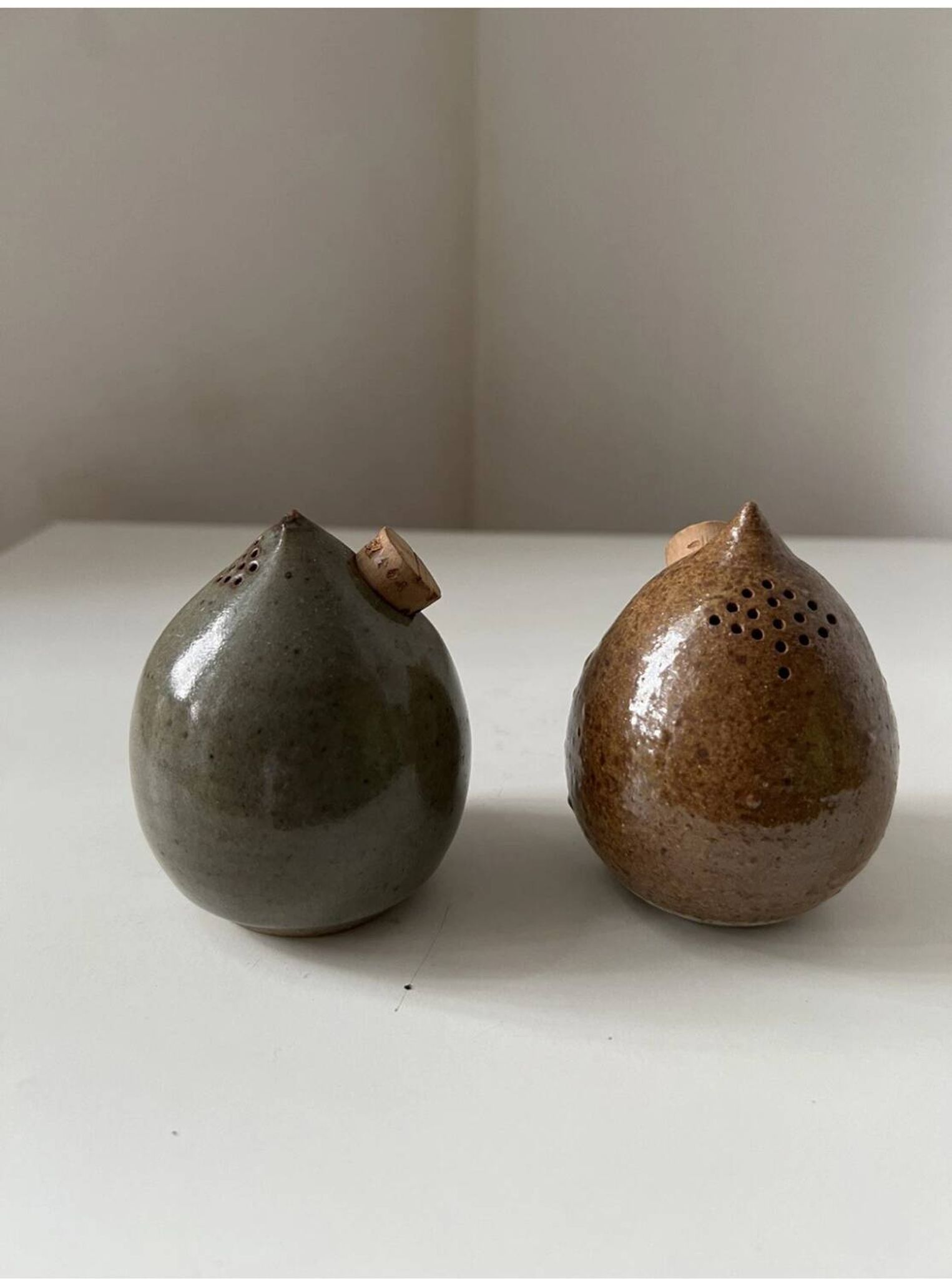 Pair of vintage round stoneware salt and pepper shakers