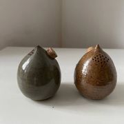 Pair of vintage round stoneware salt and pepper shakers