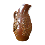 Beauvais sandstone pitcher decorated with a prizery