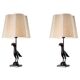 Pair of patinated bronze table lamps depicting a falcon