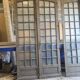 Two pairs of solid oak doors with small panes.
