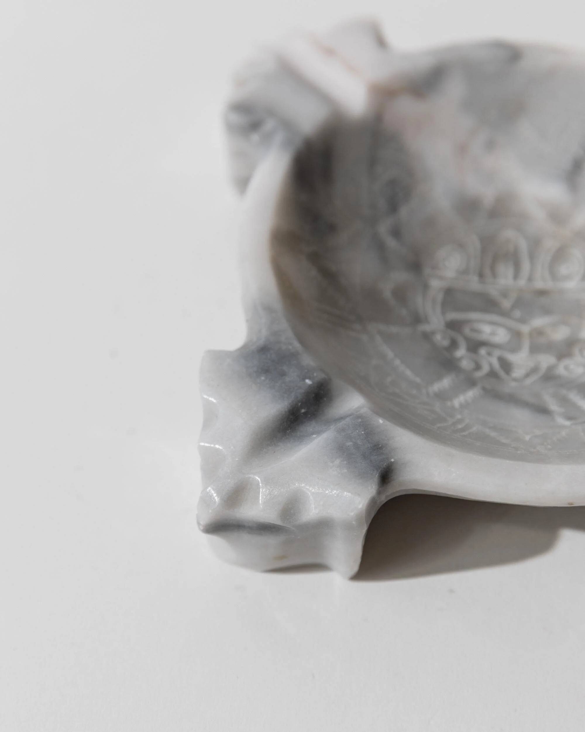 Vintage Mexican marble ashtray from the 1970s, engraved Aztec pattern.