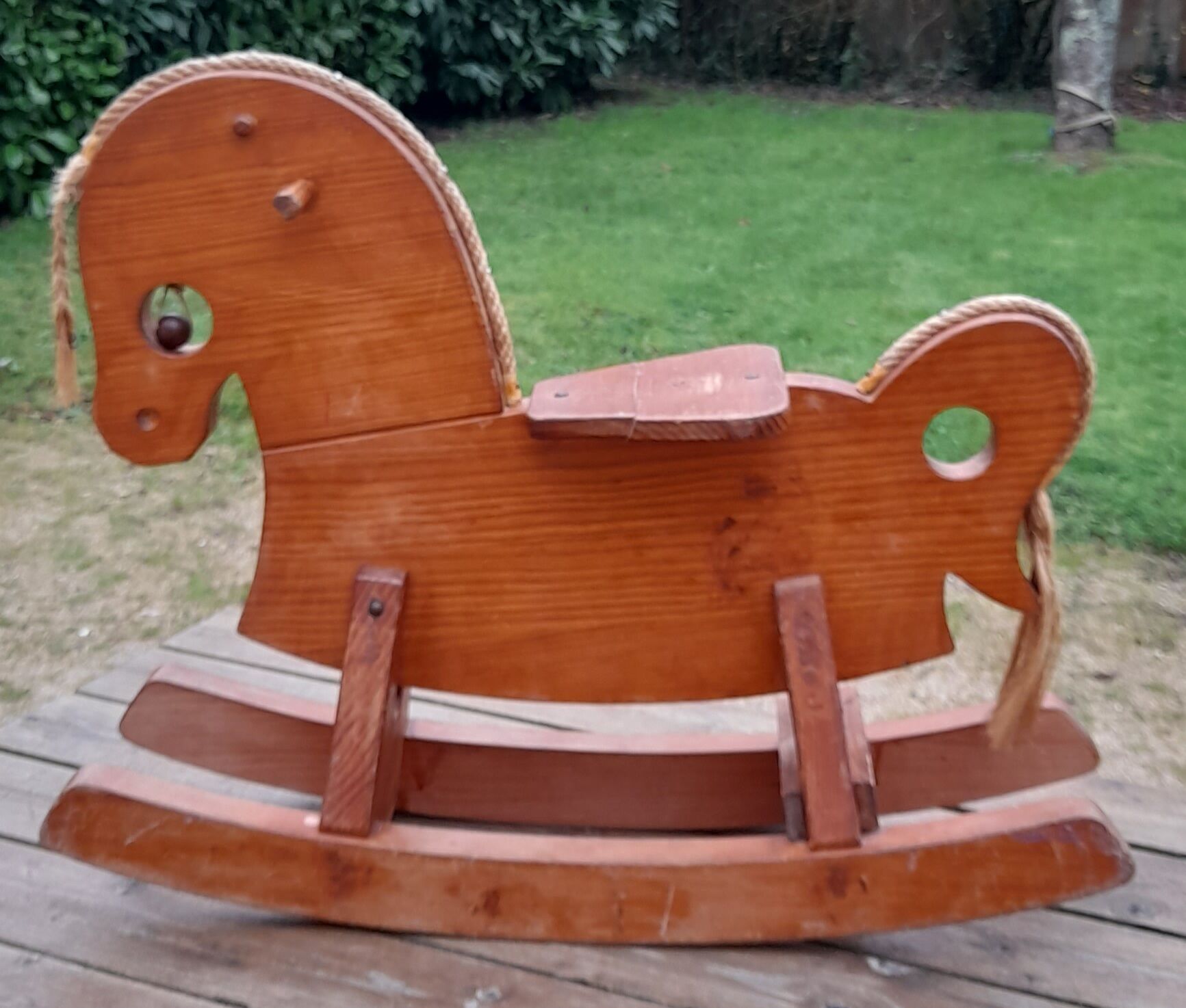 Rocking horse in raw and glazed wood