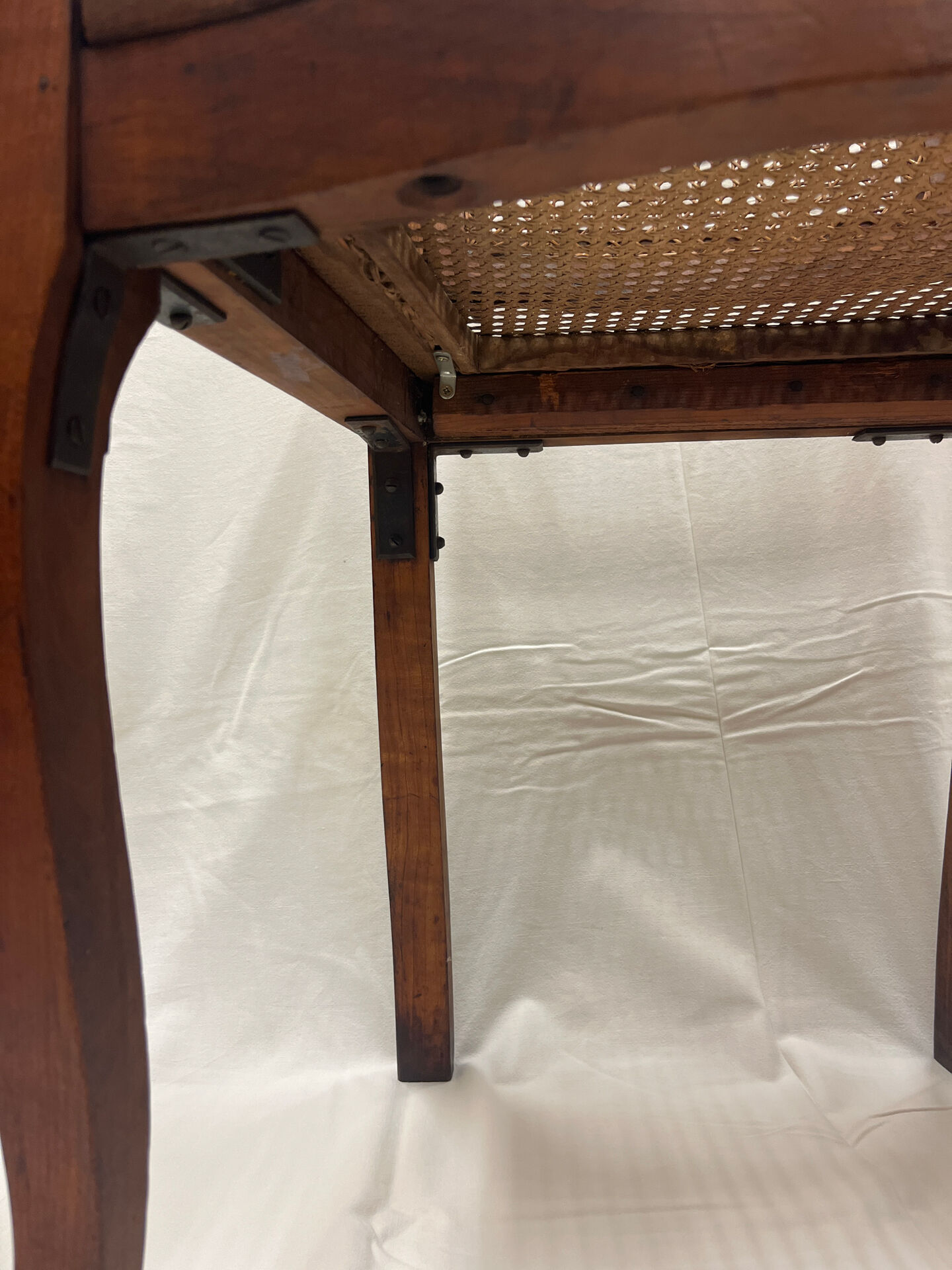 Caned armchair
