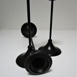Three Scandinavian black lacquered metal candle holders