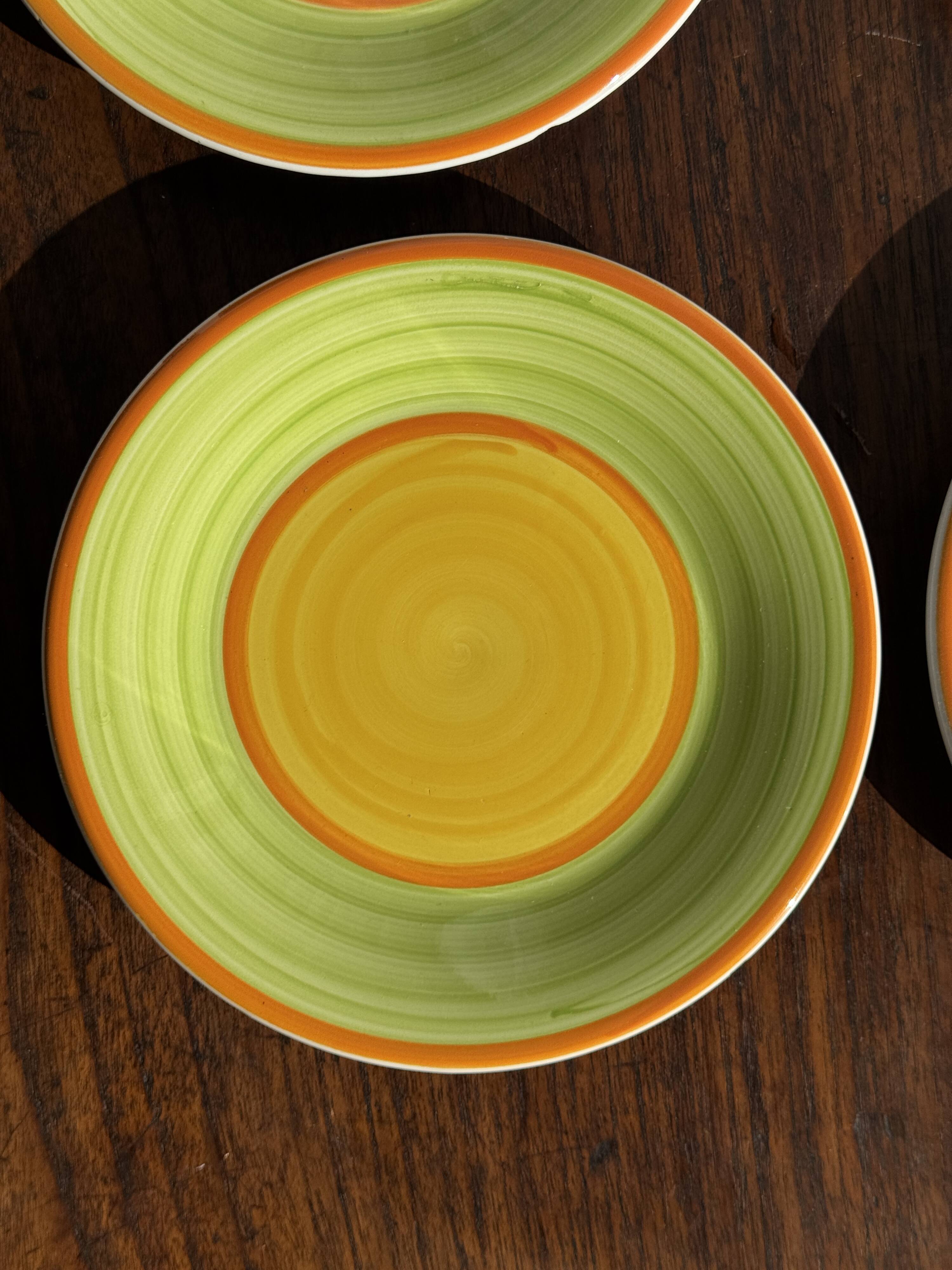 Set of 4 Italian ceramic plates in green, orange, and yellow splashes D20.