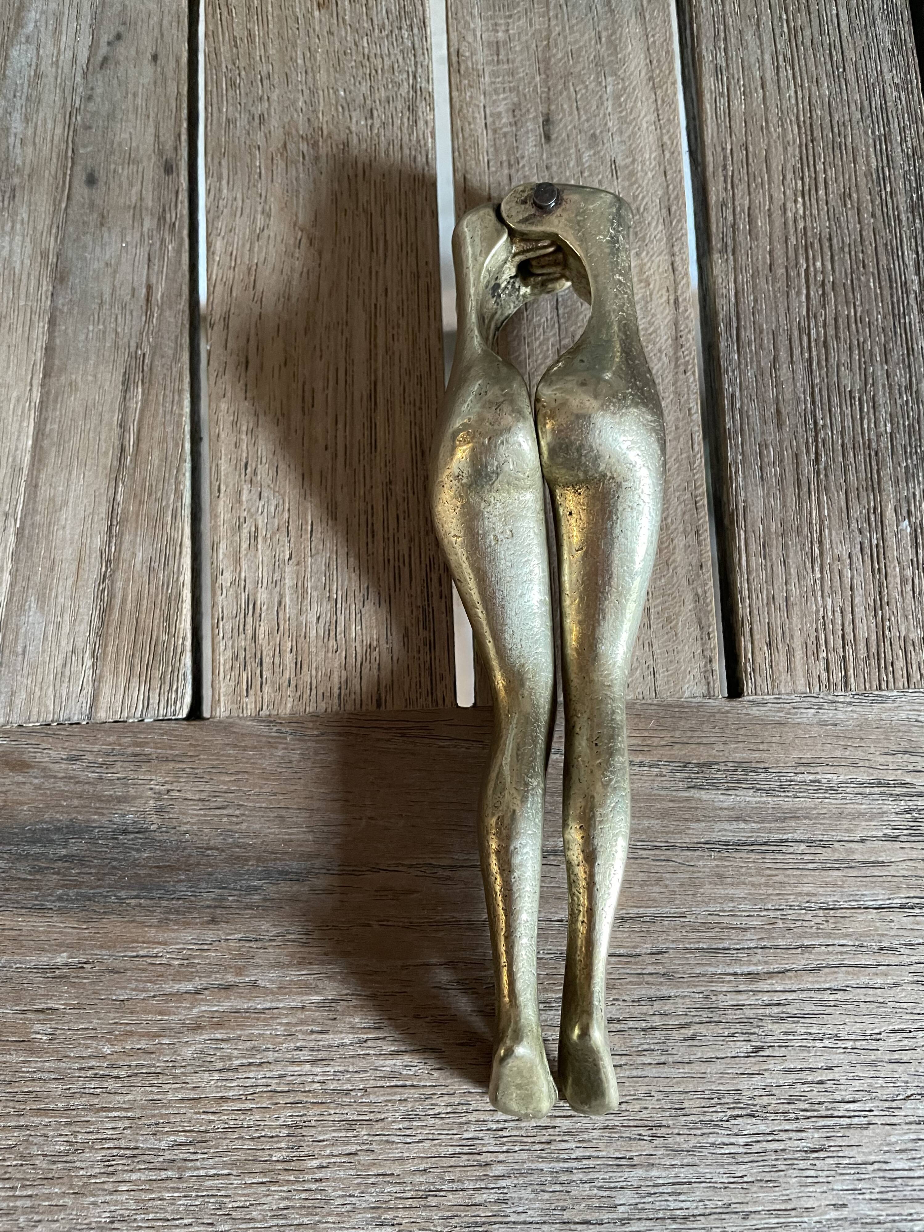 Walnut breaker in the shape of women's legs golden brass vintage