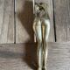 Walnut breaker in the shape of women's legs golden brass vintage