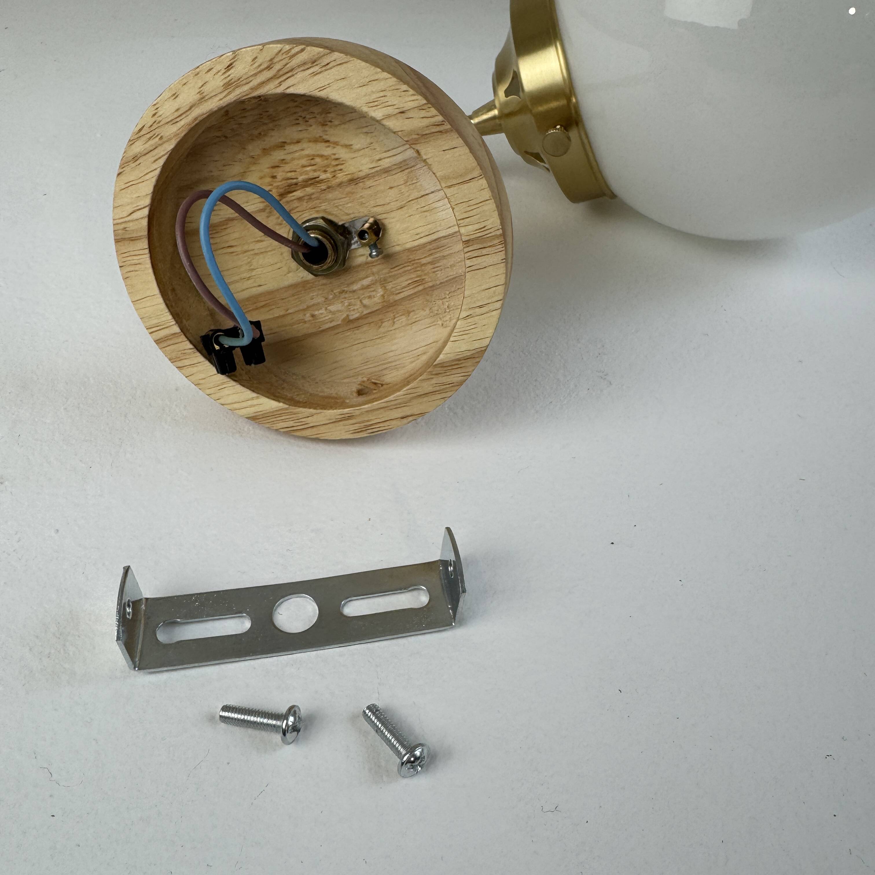 A pair of vintage opaline and brass wall lights