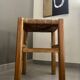 Wooden stool with straw seat