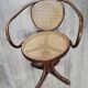Office chair with curved wood swivel screw and Thonet cannage