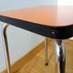 Chrome metal and orange formica stool