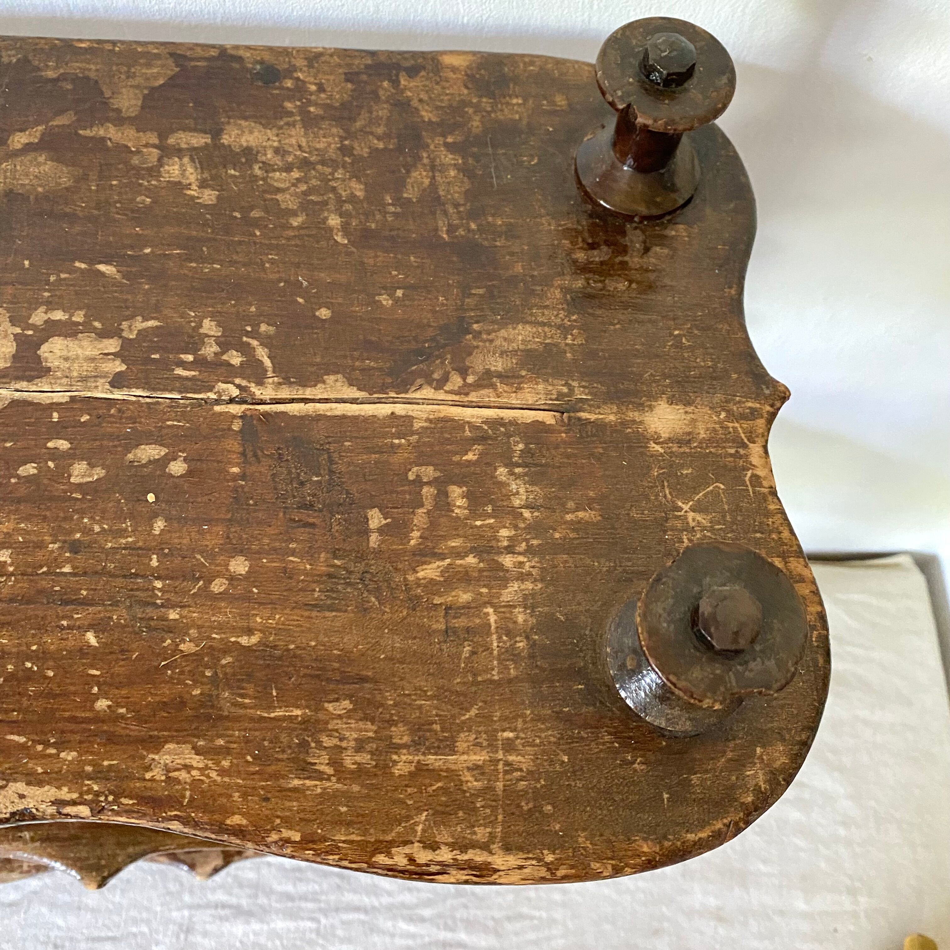 Old shelf in turned wood like reels