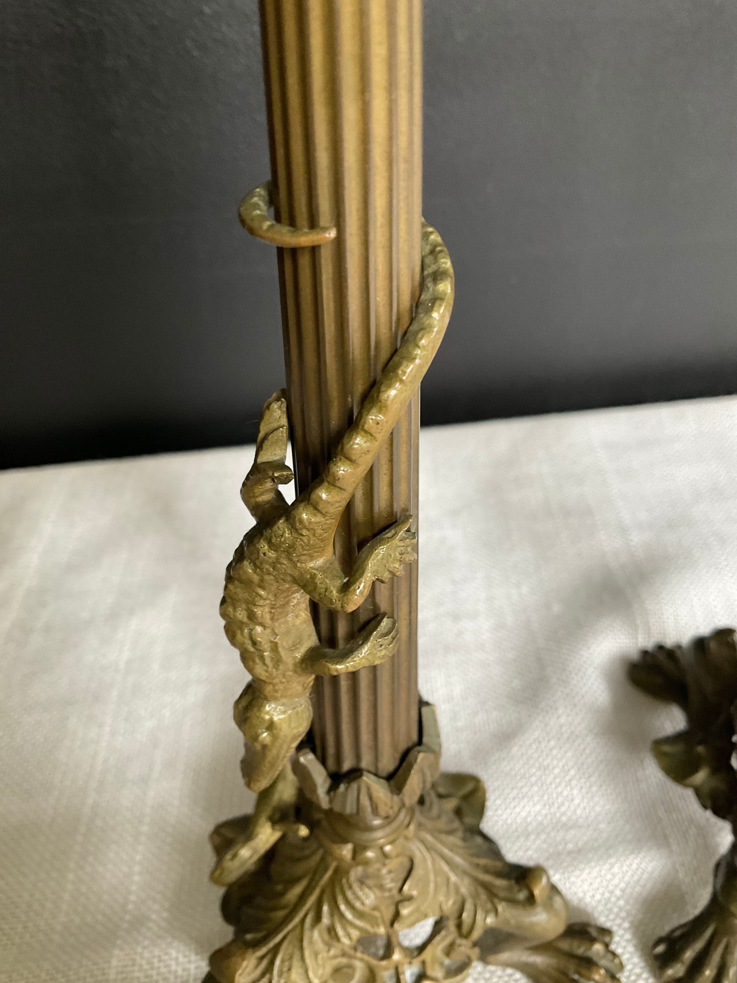 Pair of 19th-century gilded bronze candlesticks in Empire style.