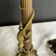 Pair of 19th-century gilded bronze candlesticks in Empire style.