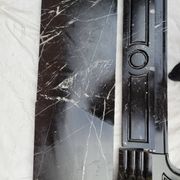 Pompadour fireplace with black marble modillions