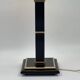 Vintage table lamp in black lacquer and gold metal, fluted column.