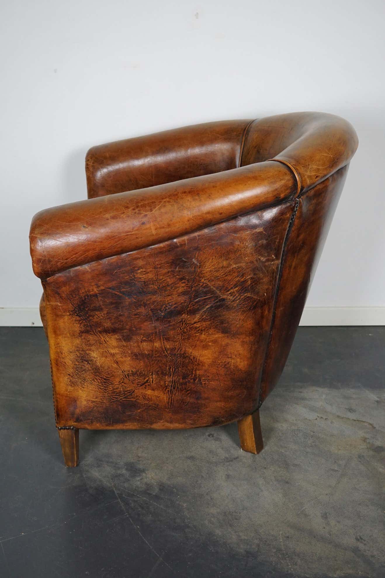 Vintage club armchair in leather color cognac Netherlands