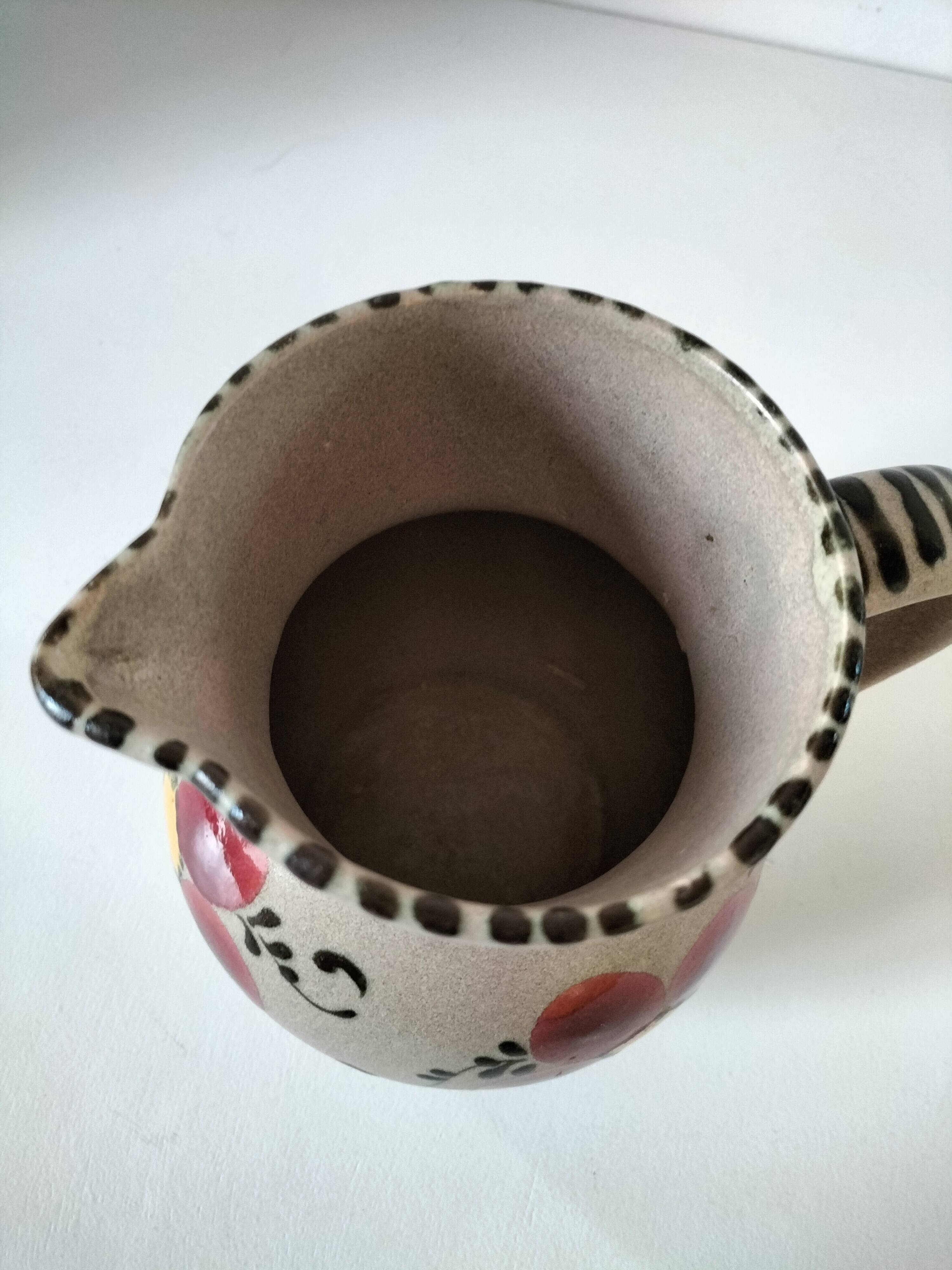 Vintage stoneware pitcher with hand-painted floral decoration, 1960s–70s