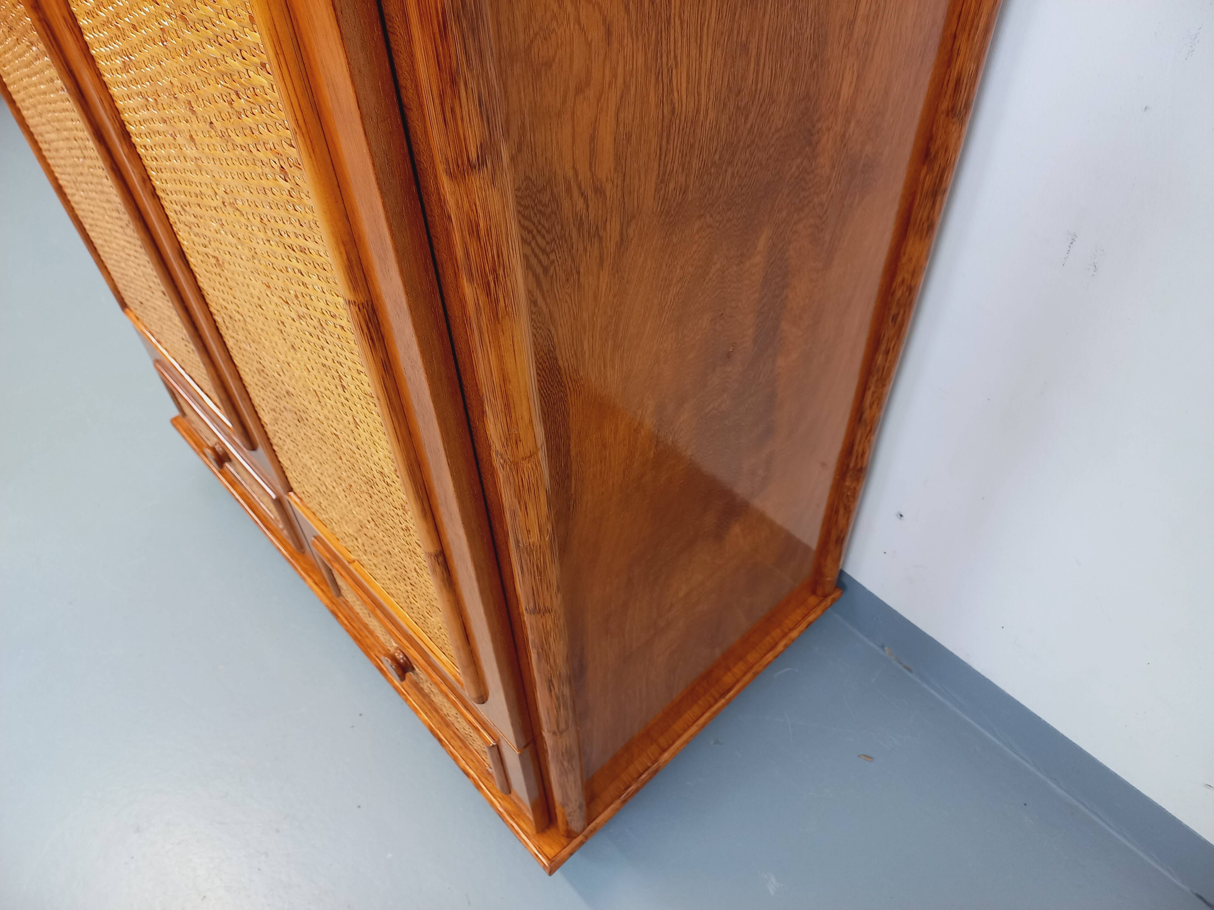Vintage woven rattan and wood armoire by Maugrion for Roche-Bobois.
