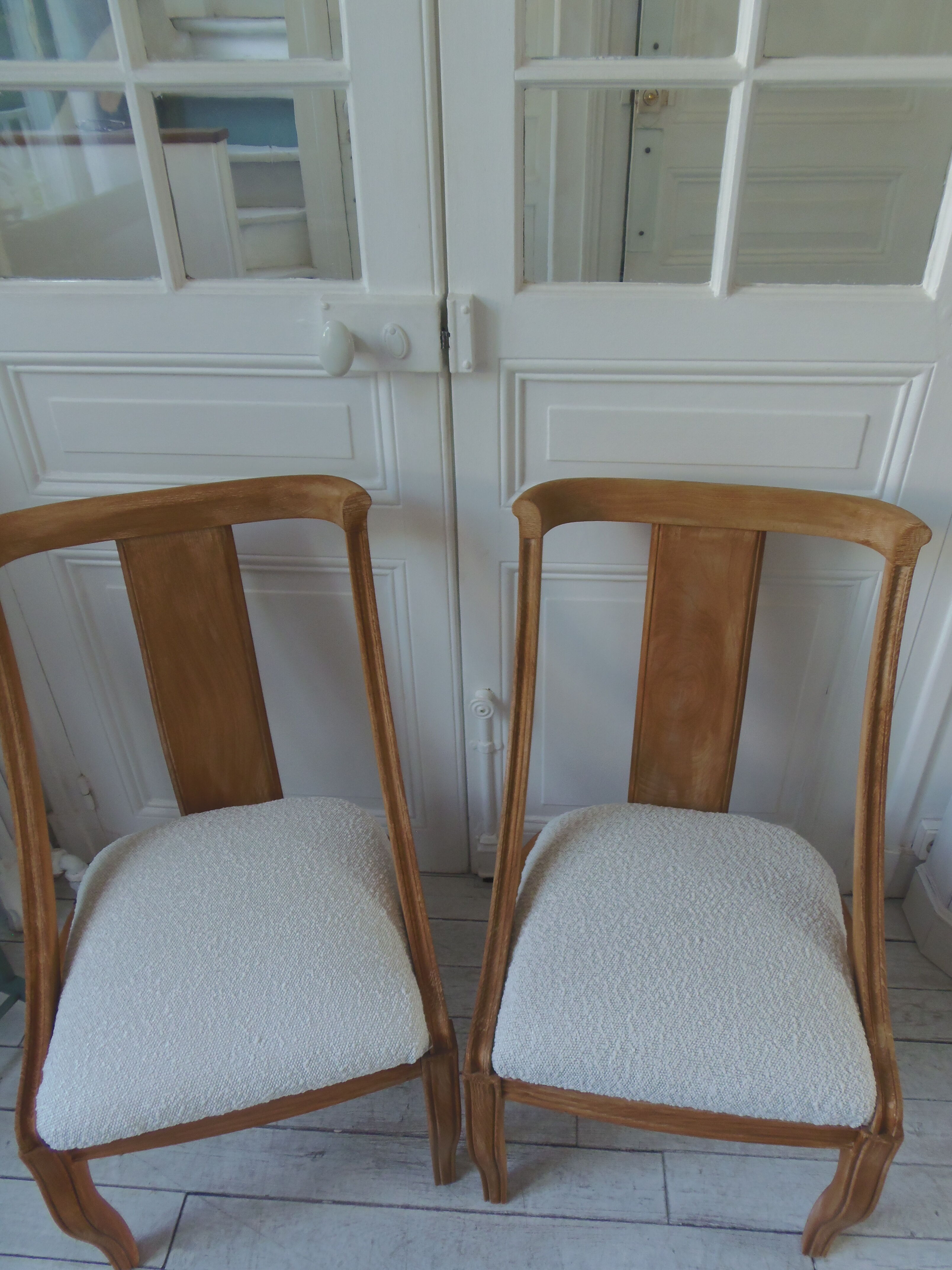 Pair of Gondola heaters, upholstered with a cream curl fabric