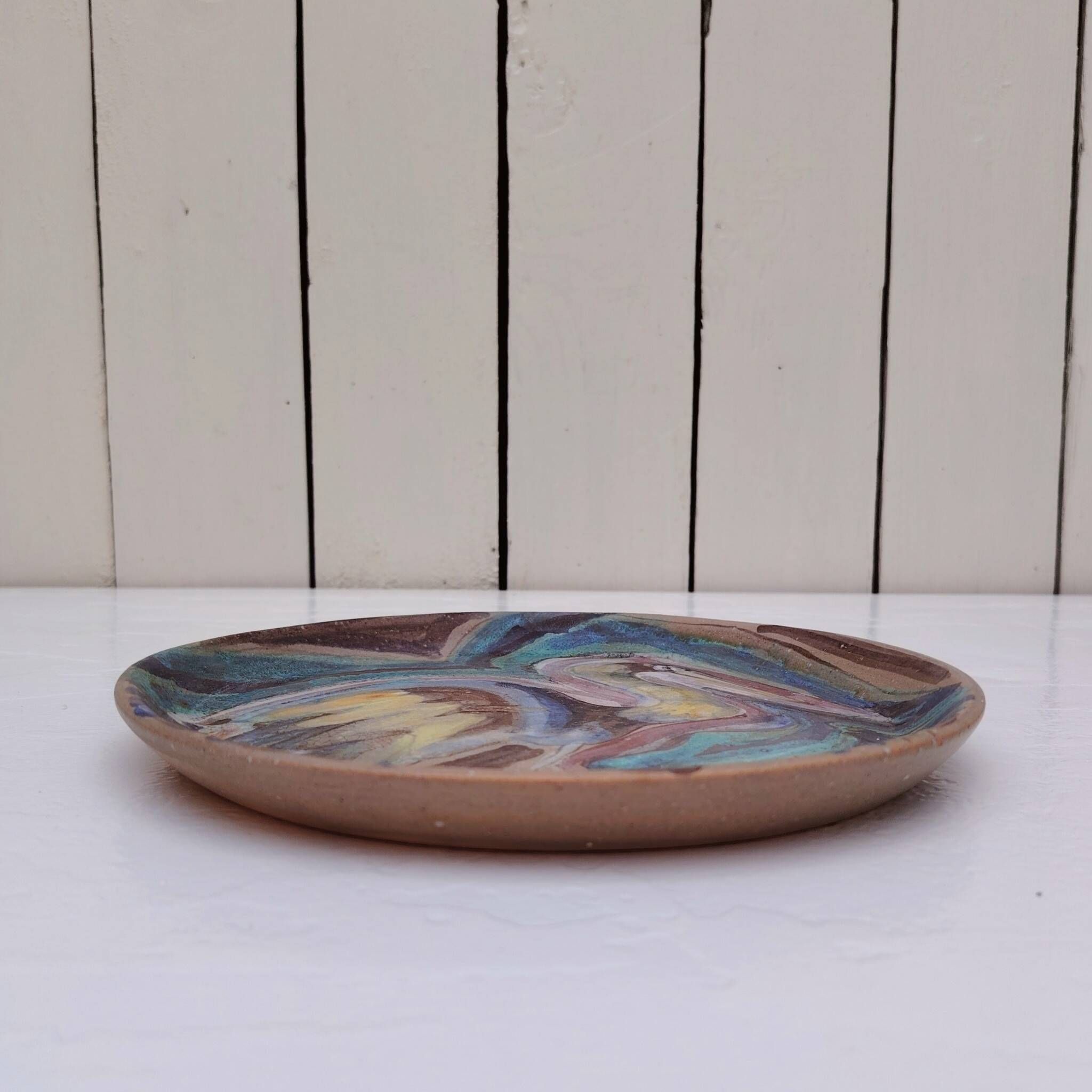 Ceramic plate with a bird, signed, vintage