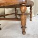 Low wooden stool with caning, footrest.