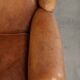 Sheepskin wingback armchair in a light cognac colour in English style