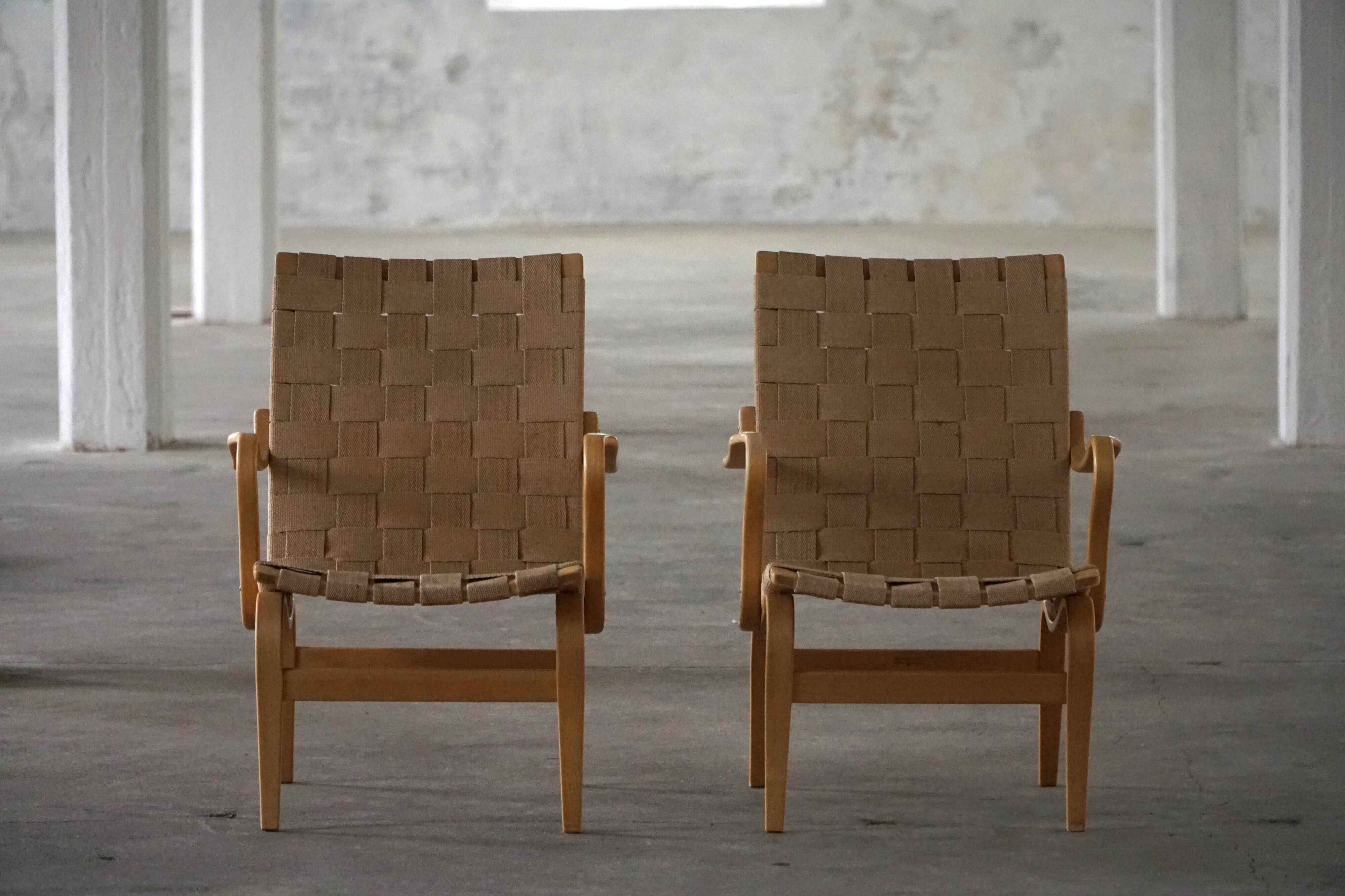 Pair of Swedish armchairs from the mid-century by Bruno Mathsson, model "Eva", 1960s.