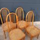 Set of 4 vintage Baumann chairs in honey wood and cane.