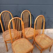 Set of 4 vintage Baumann chairs in honey wood and cane.