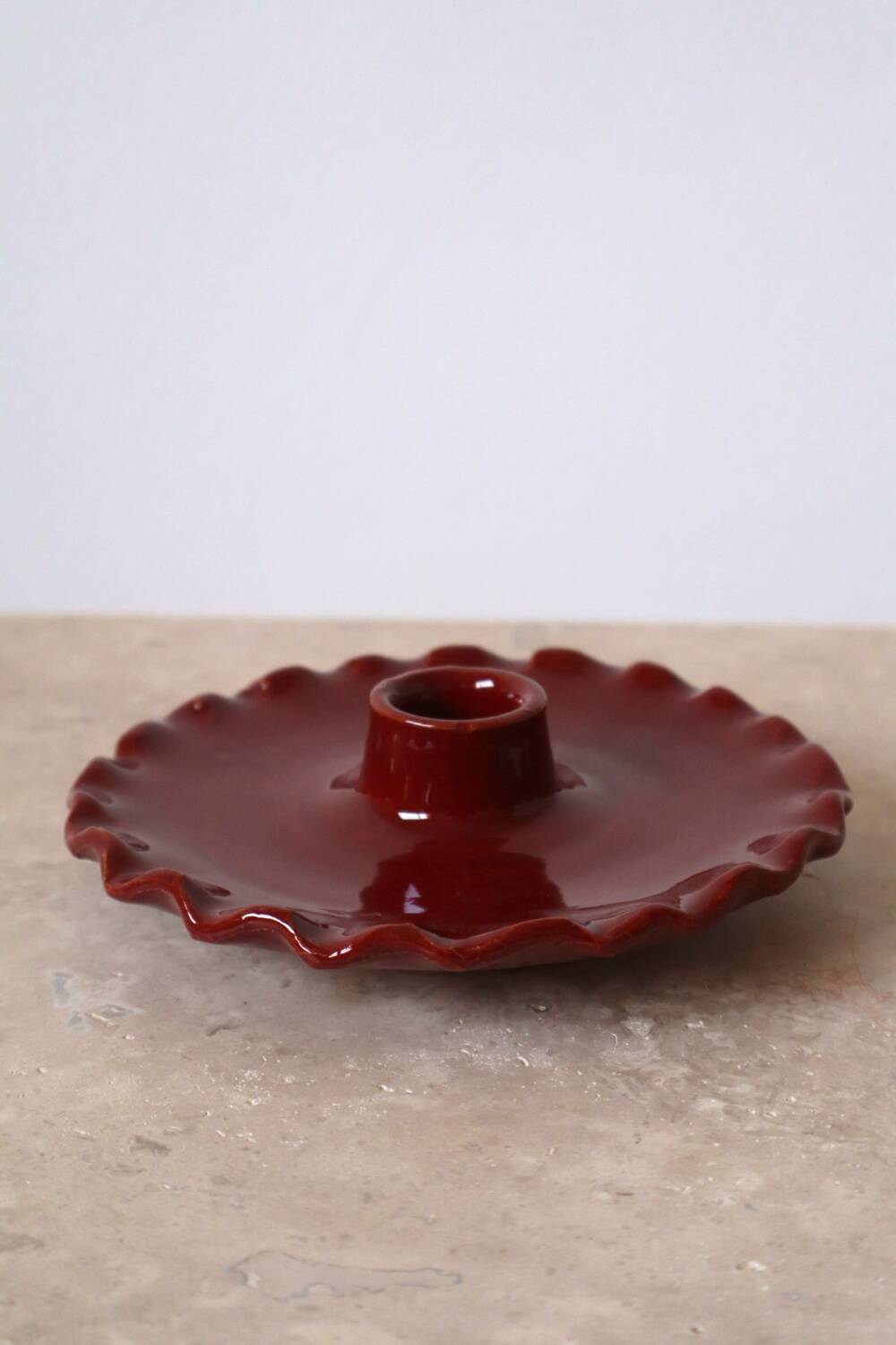 Burgundy ceramic candle holder with serrated plate