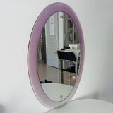 Vintage oval plexiglass mirror from the 70s by Harvey Guzzini