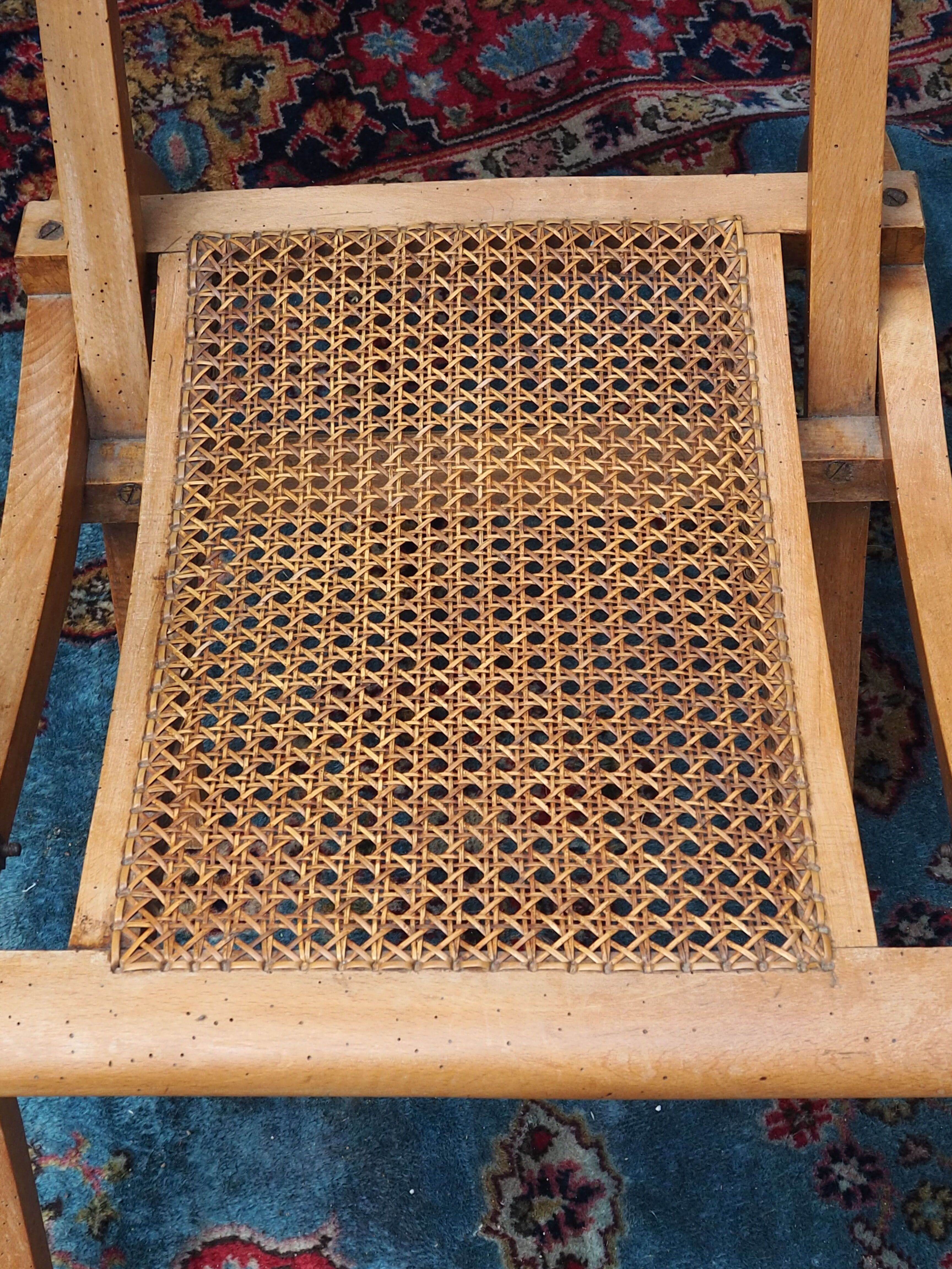 Cane folding armchair in solid wood