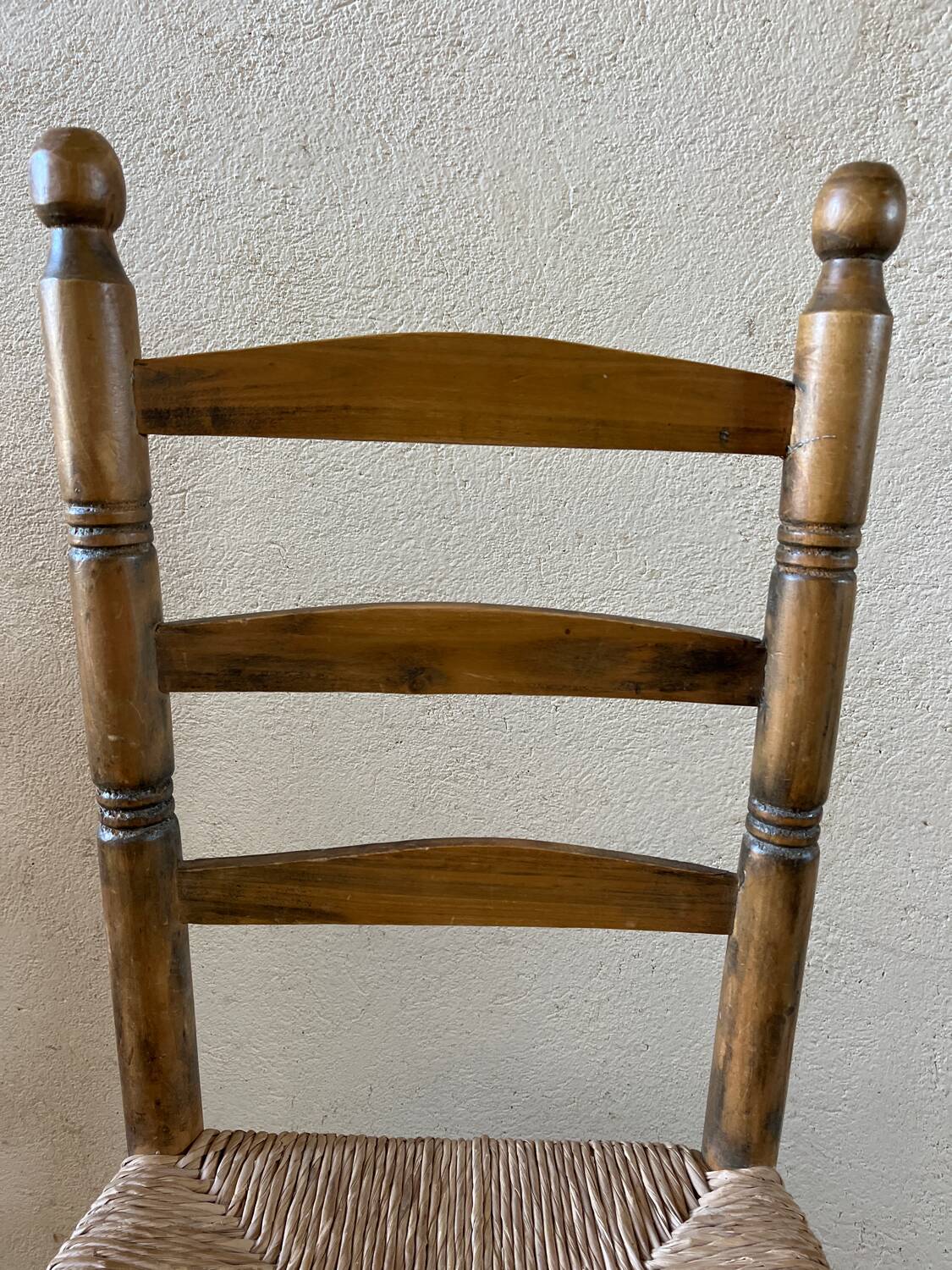 Old turned and stuffed wooden chair