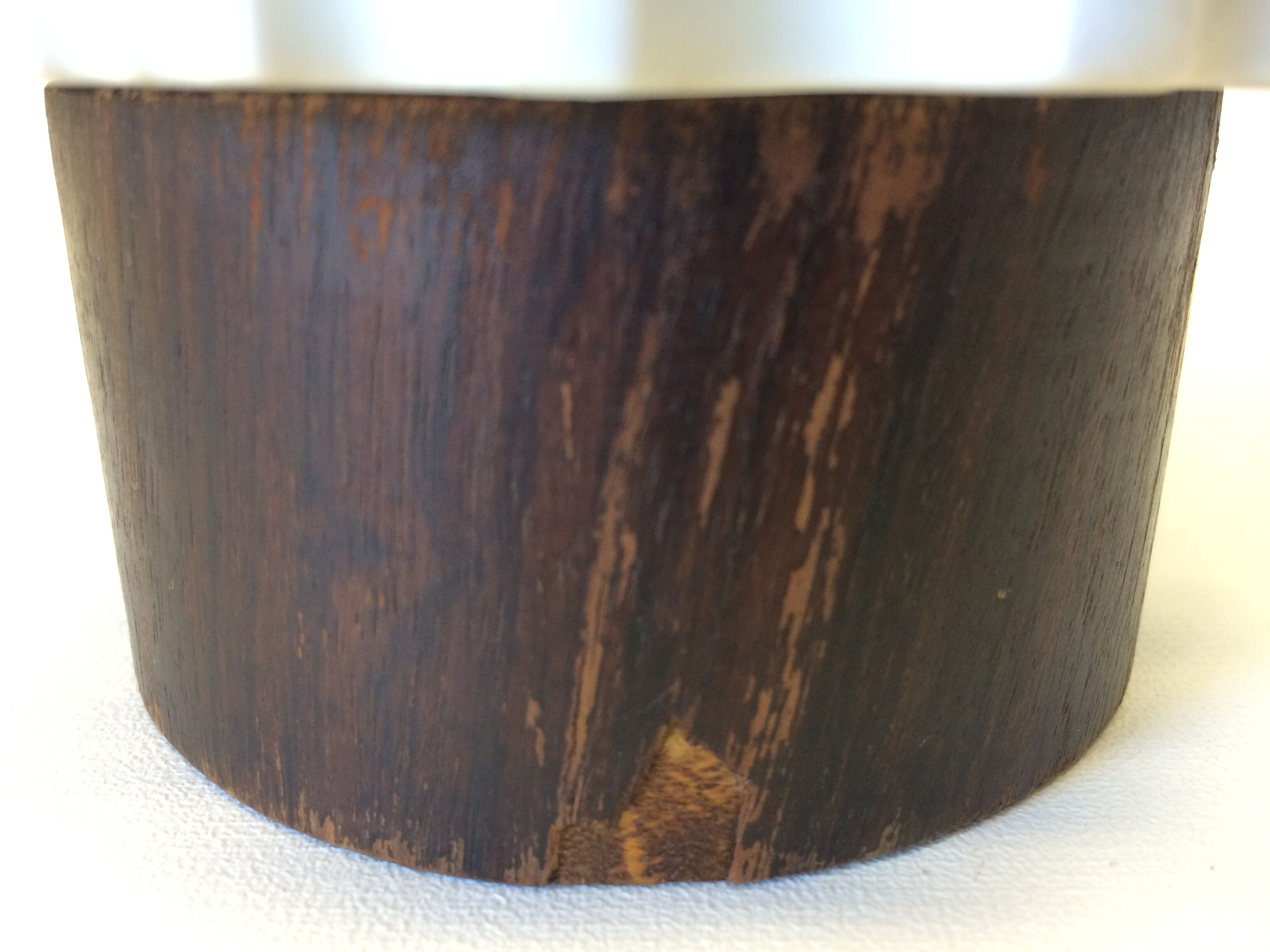 White vase on wooden base