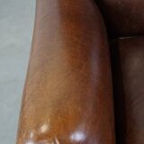 Sheep leather armchair on wheels