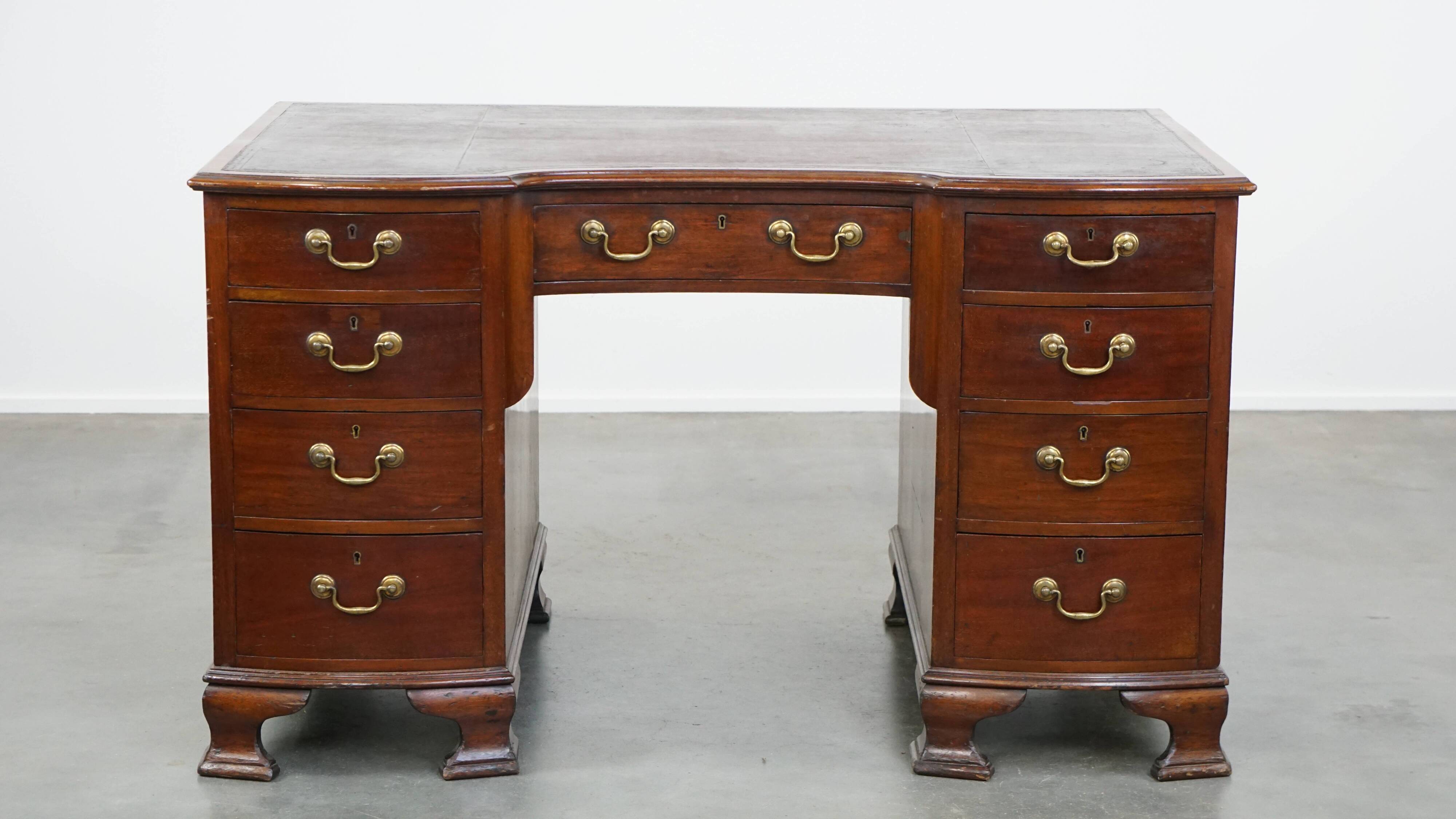 Antique wooden English desk from the late 19th century with a leather top