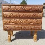 Compact 4-drawer ethnic chest of drawers carved with scenes of African life